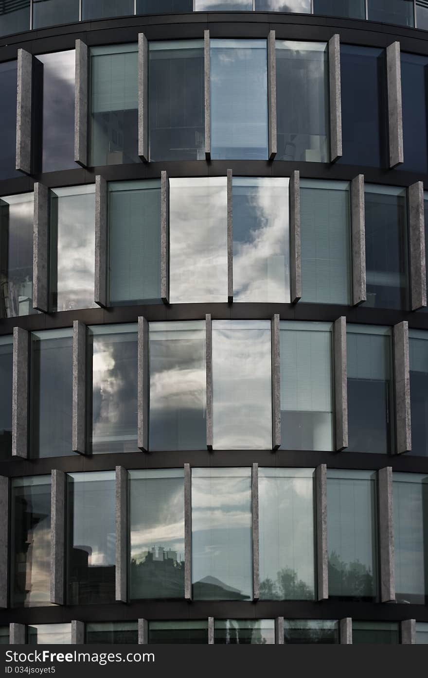 Facade of a modern building - stone and glass