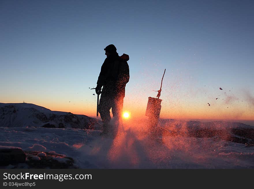 Climber on Mount Kupena - 2169 m altitude in the Central Balkan Mountains in eastern Europe at sunrise