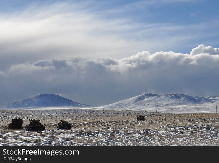 Rolling storm clouds over the desert landscape