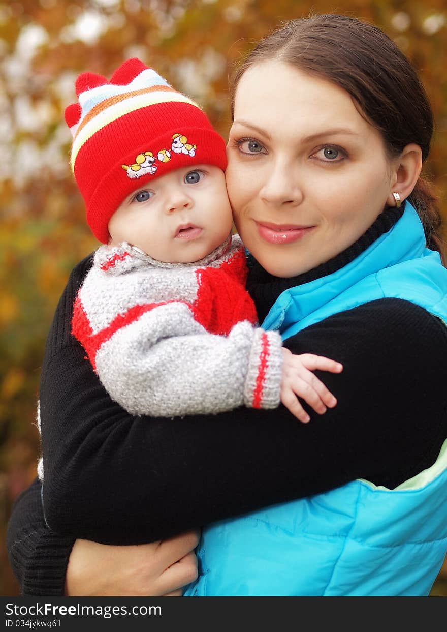 Mother with her baby during autumn. Mother with her baby during autumn