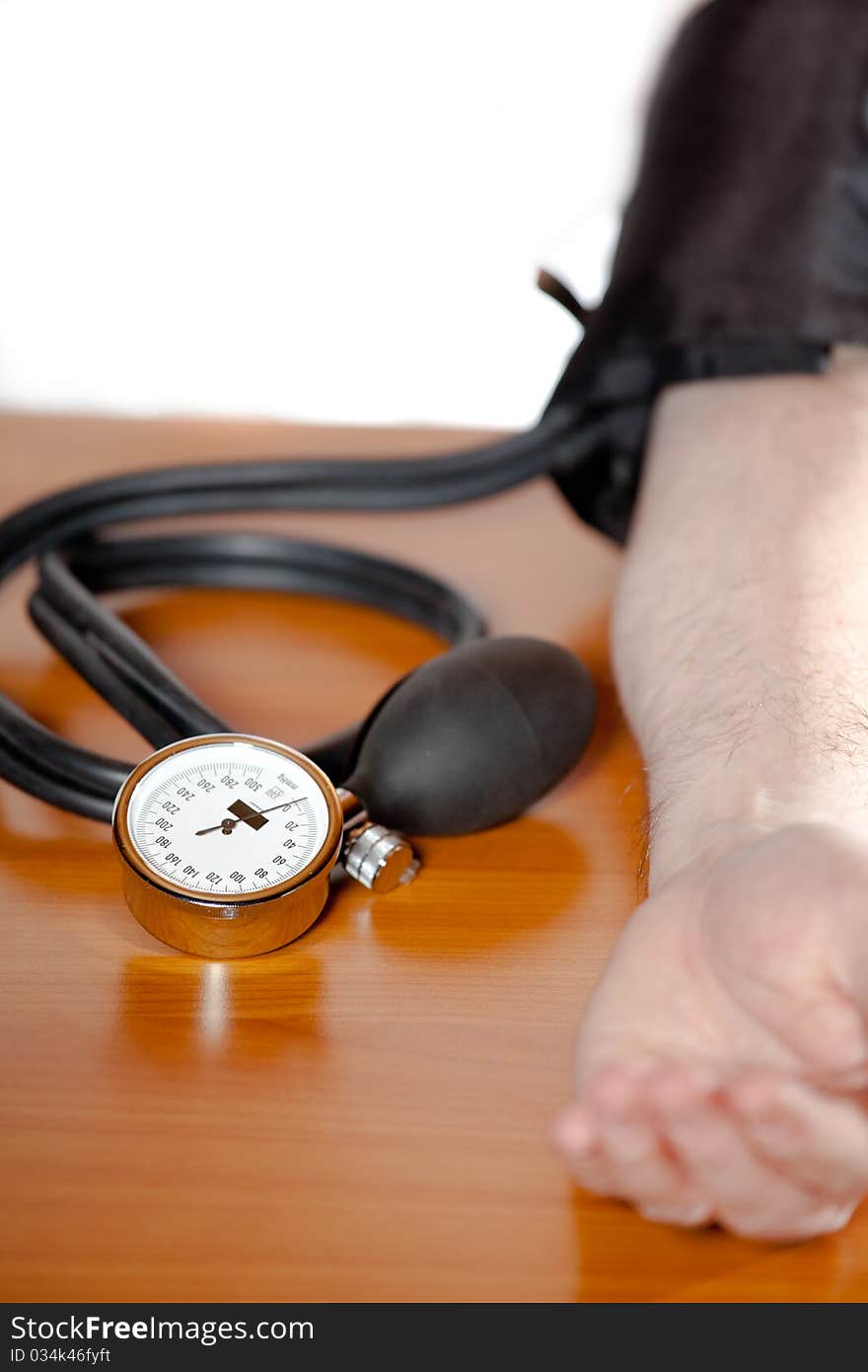 Blood Pressure Gauge At Man`s Arm