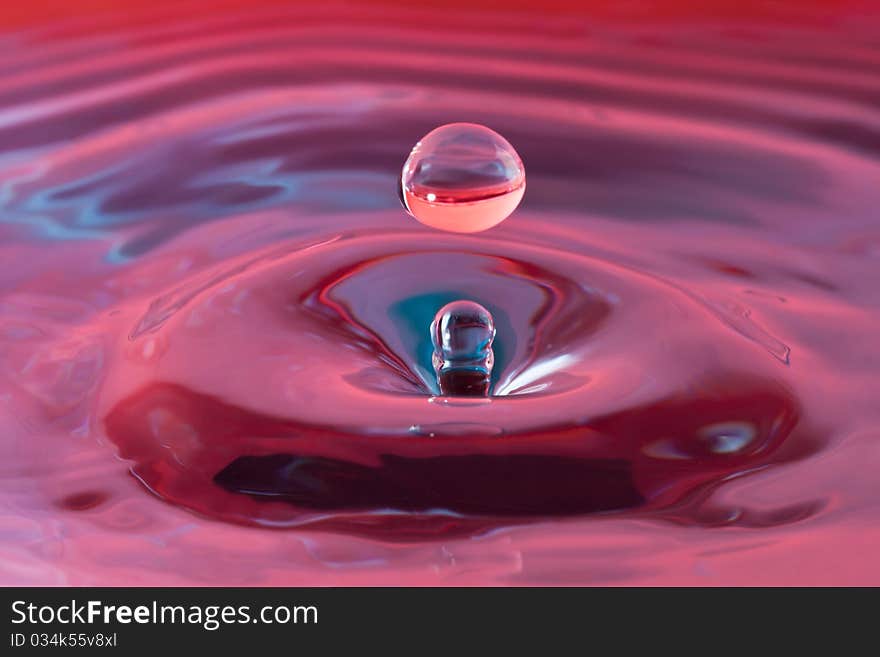 Coloured water drop on reservoir. Coloured water drop on reservoir