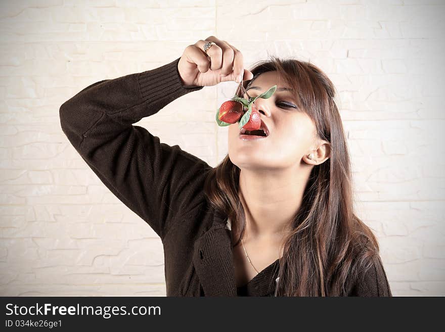 Beautiful girl eating fresh strawberries. Beautiful girl eating fresh strawberries.