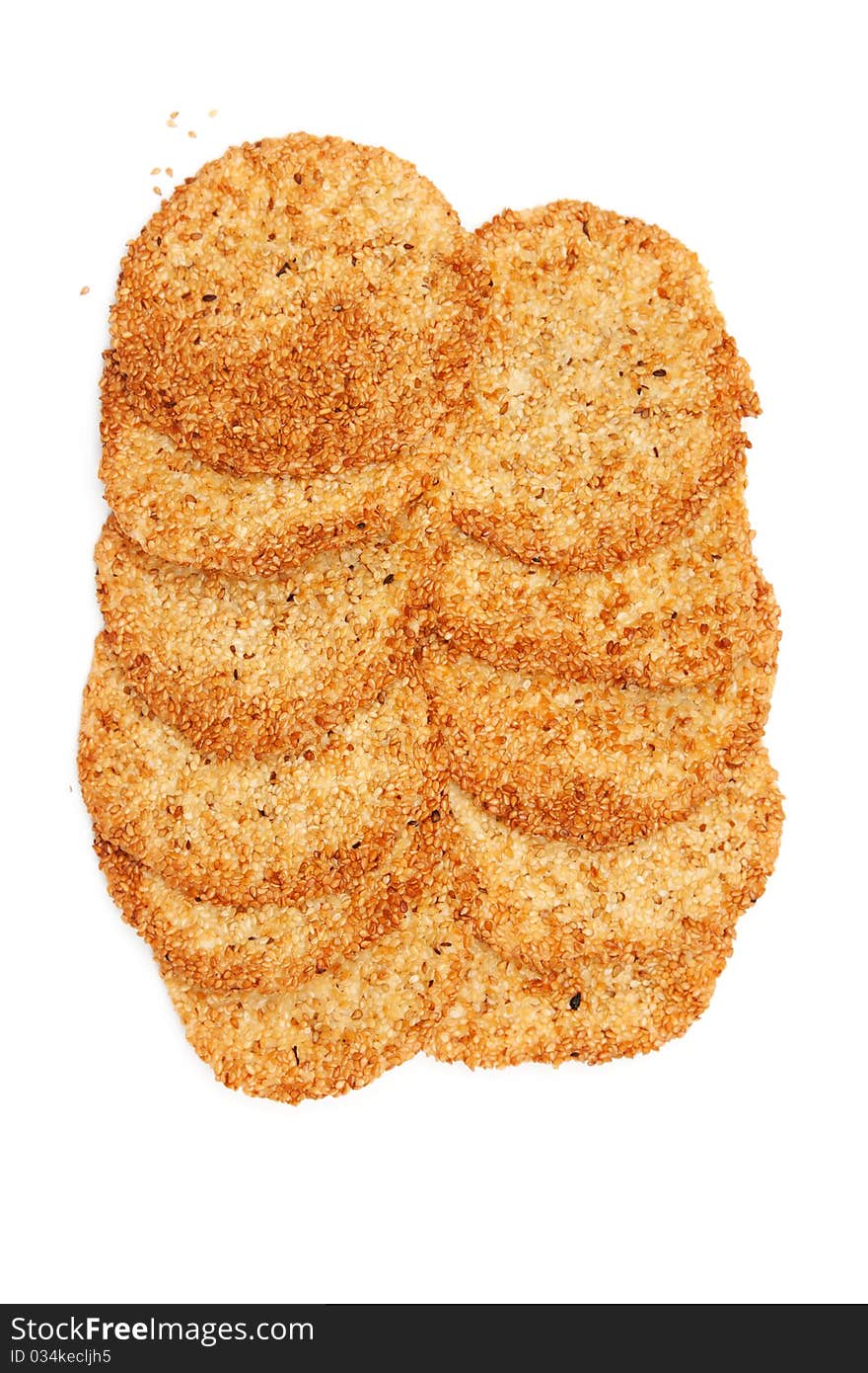 Biscuits with sesame seeds on a white background