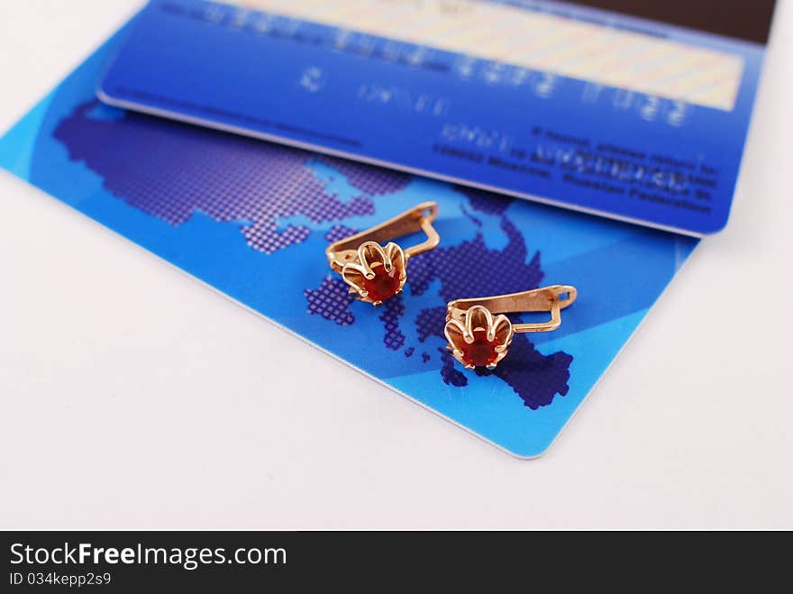 Earrings and cards on white background