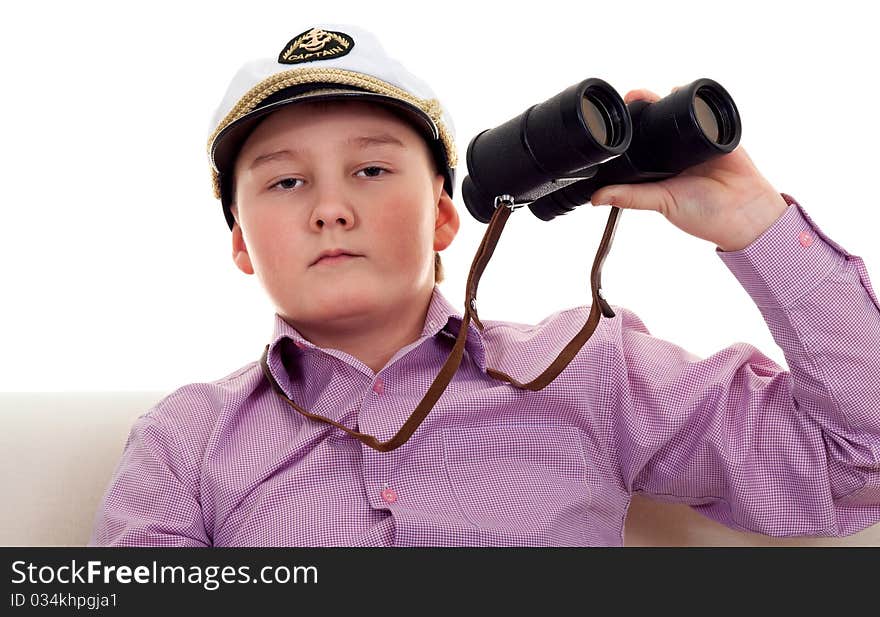 Strict boy with glasses and a cap Captain