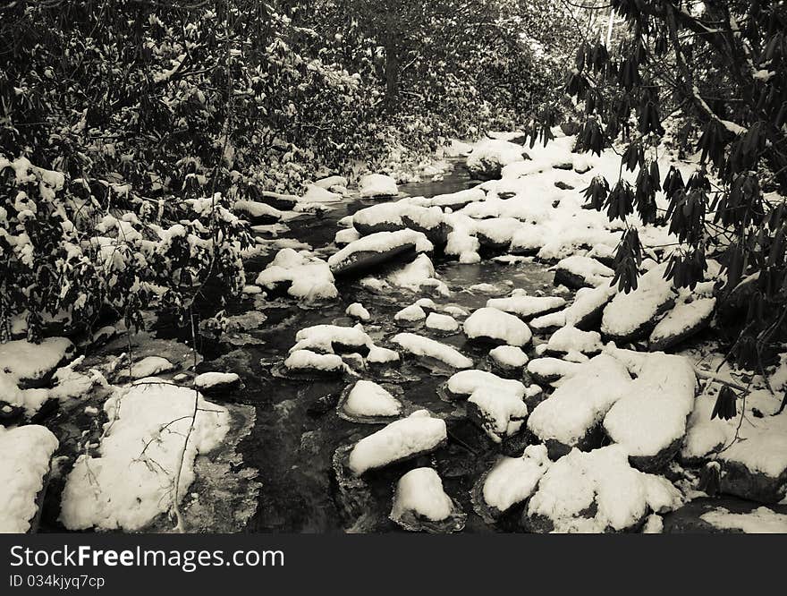 View along the Jacobs Fork River at South Mountain State Park after a snow fall. View along the Jacobs Fork River at South Mountain State Park after a snow fall