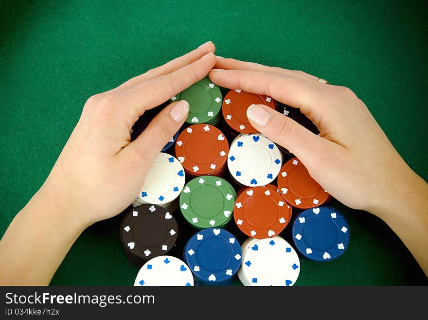 Casino win, gambling chips taken by hands