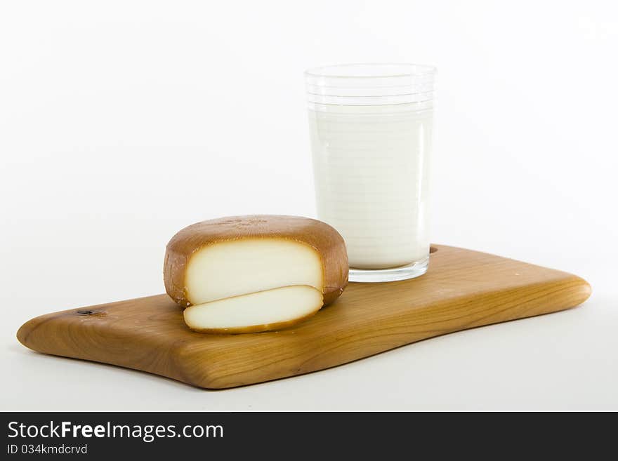 Smoked cheese with glass of milk