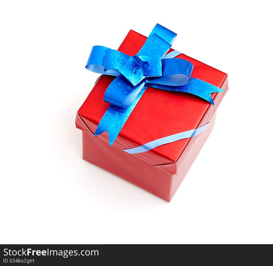 Red gift box with blue bow isolated on white