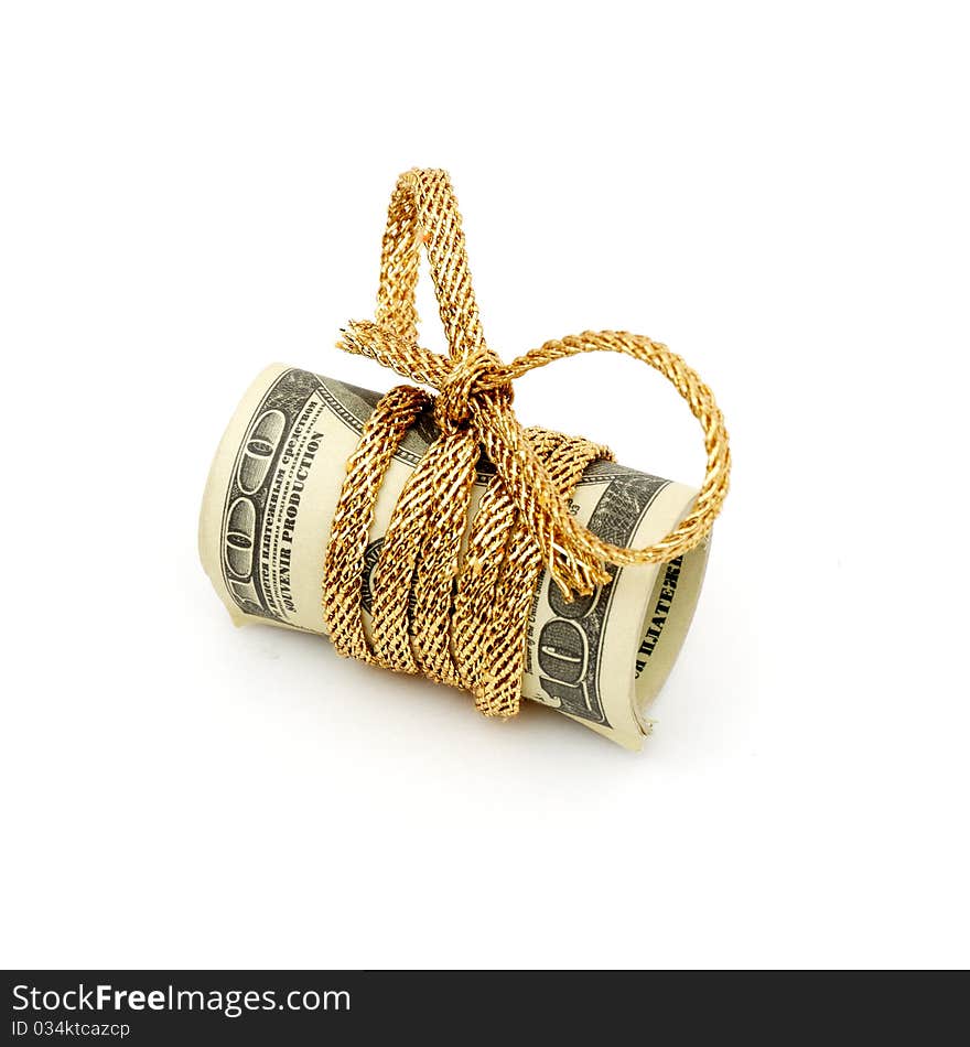 Stack of money tied up with a silver and gold ribbon on a white background. Stack of money tied up with a silver and gold ribbon on a white background.