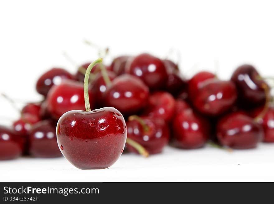 Fresh red cherry isolated on white