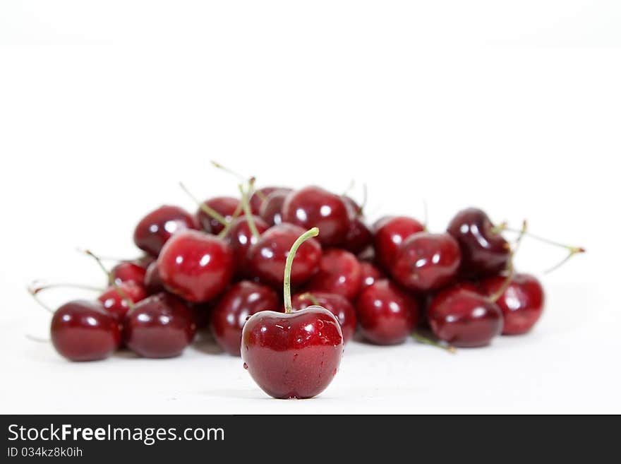 Fresh red cherry isolated on white background