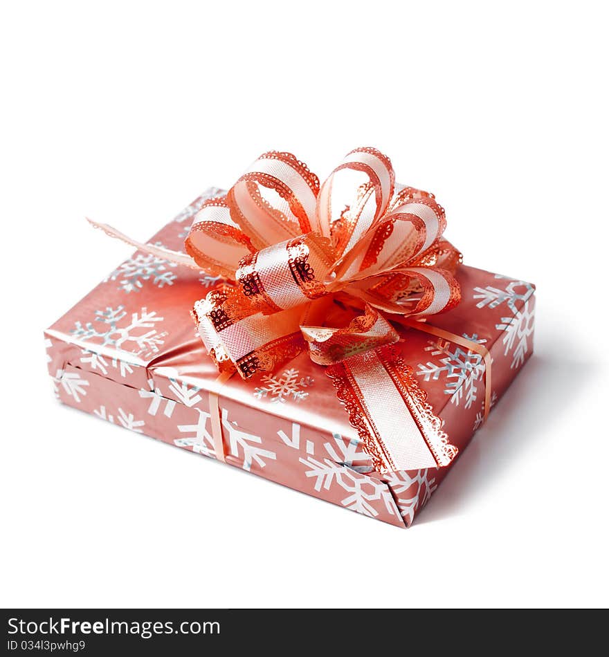 Red box tied with a ribbon-bow on white background. Red box tied with a ribbon-bow on white background