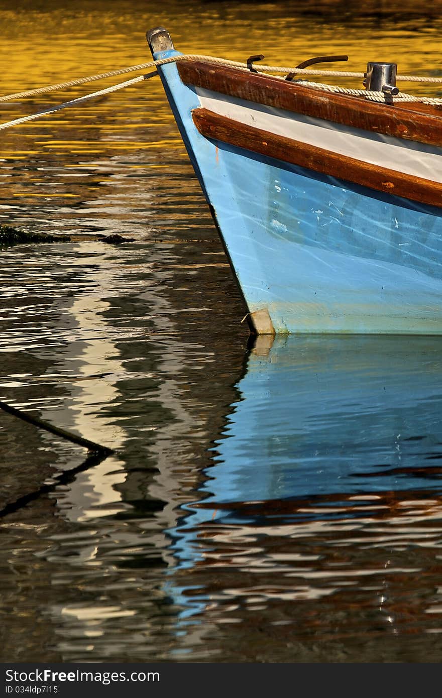 Blue boat reflection on water