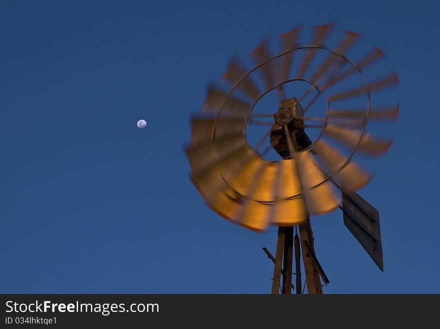 Windmill at sunset in clearing. Windmill at sunset in clearing