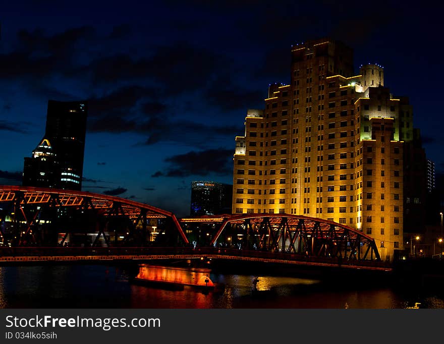 Night view of garden bridge with building Shanghai