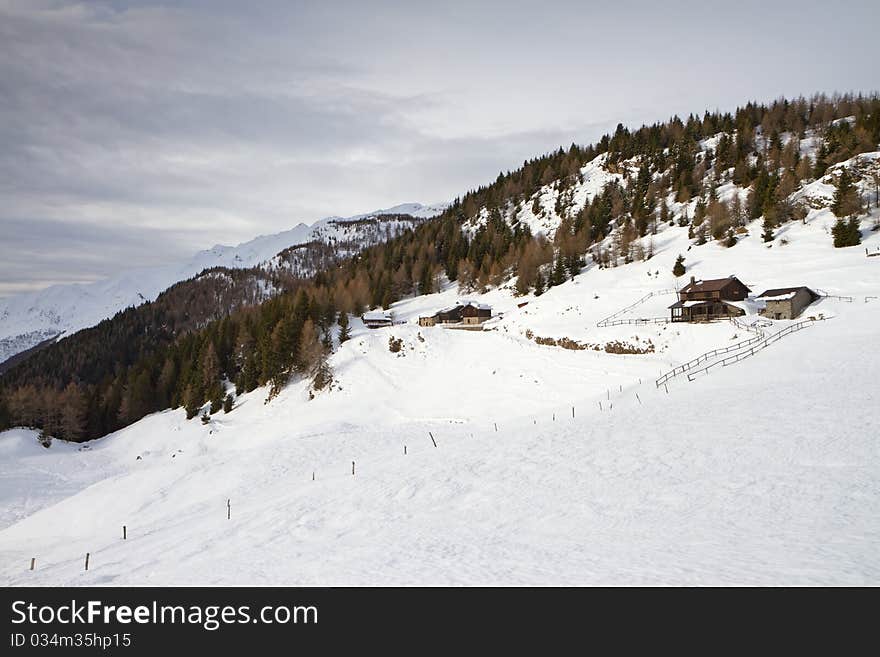 Cabins Under Snow