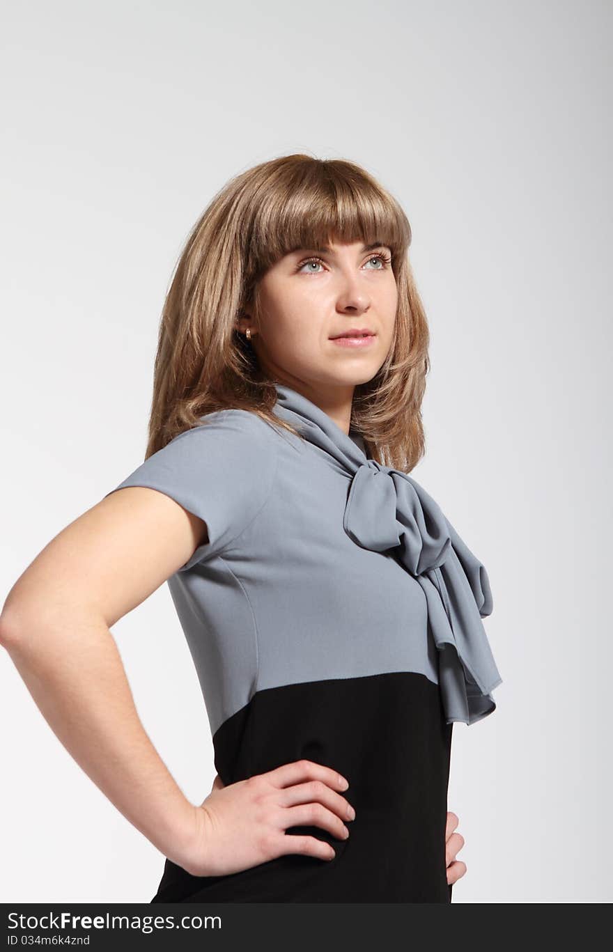 Young business woman in grey and black dress