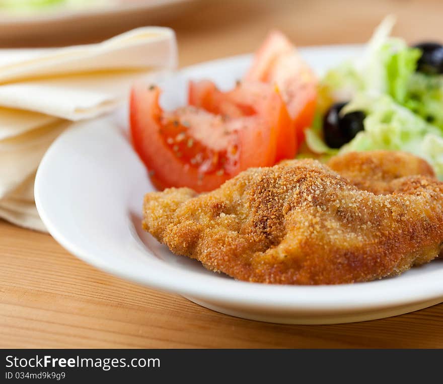 Schnitzel with vegetable salad