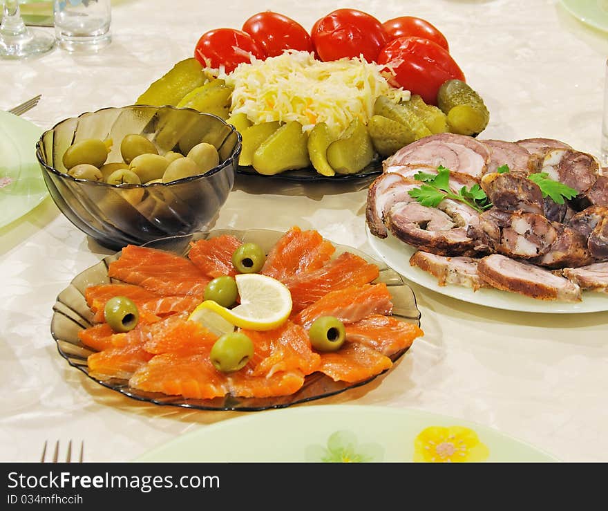 Celebratory supper with fish, meat and olives