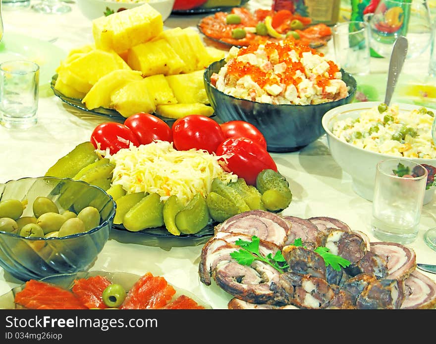 Celebratory supper with fish, meat and olives