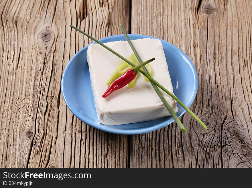 Block of fresh cheese on a plate