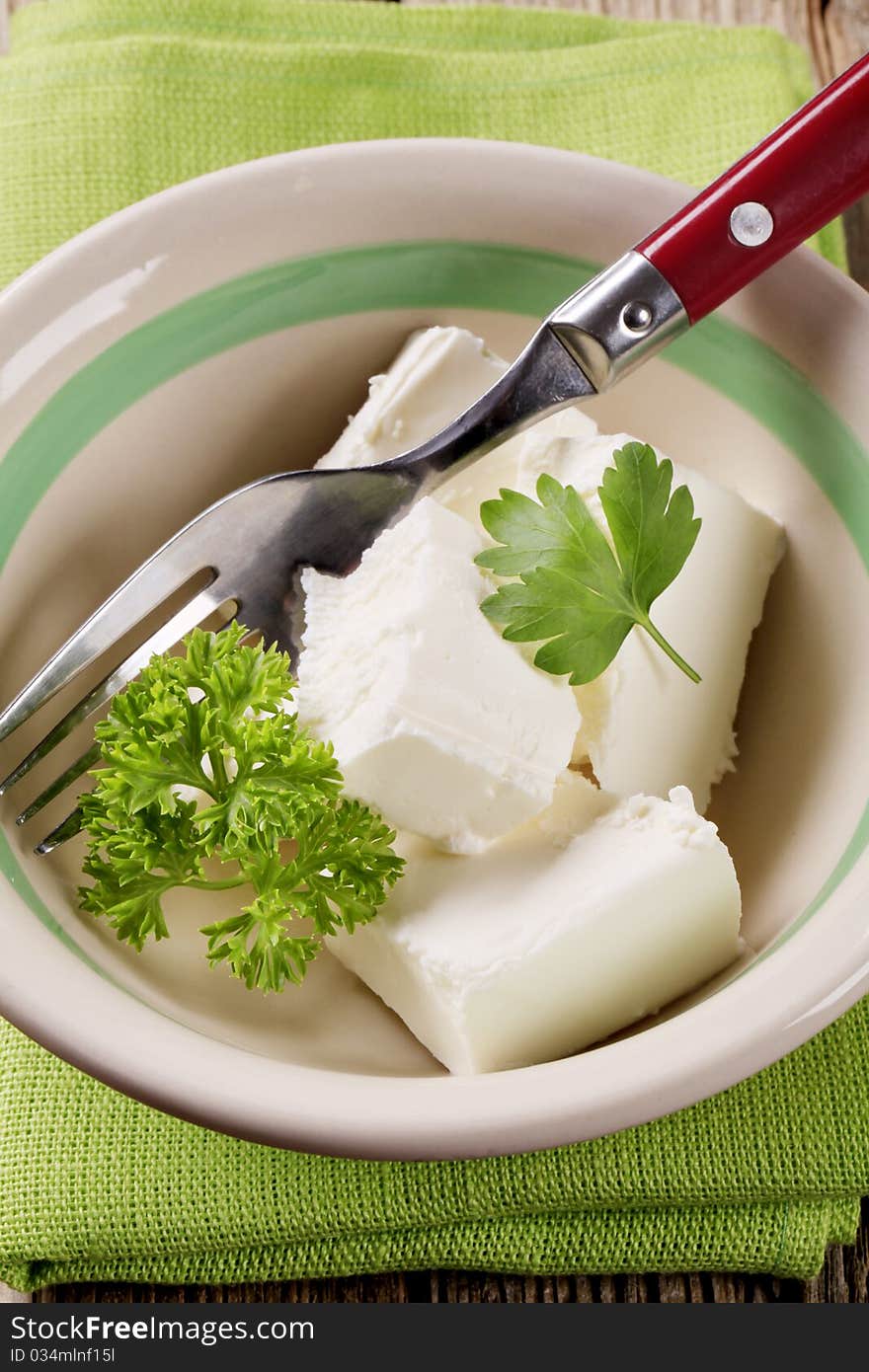 Blocks of fresh cheese in a bowl