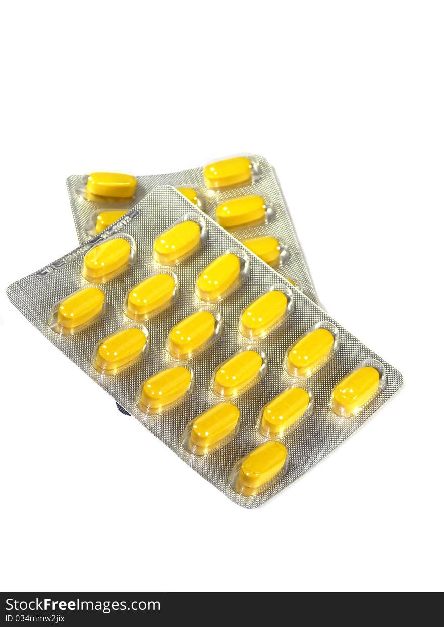 Yellow pills in blister isolated