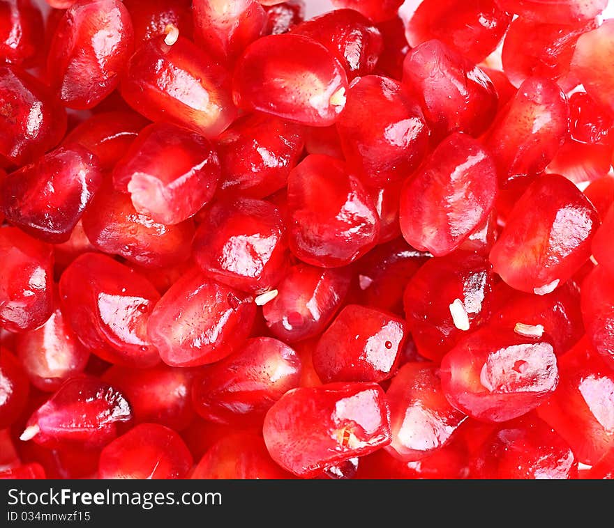 Fruit garnet isolated over white background, macro shot