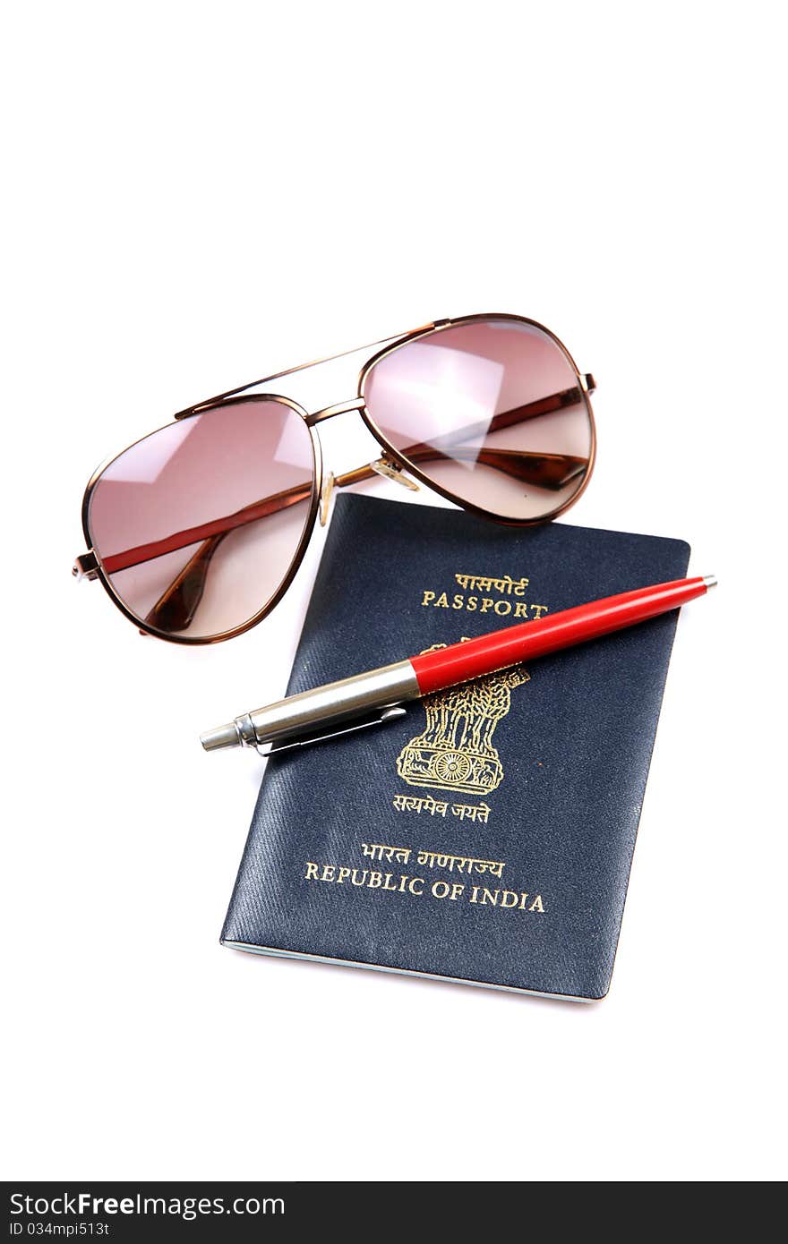 Concept shot of indian passport with pen and goggles over white background. Concept shot of indian passport with pen and goggles over white background.