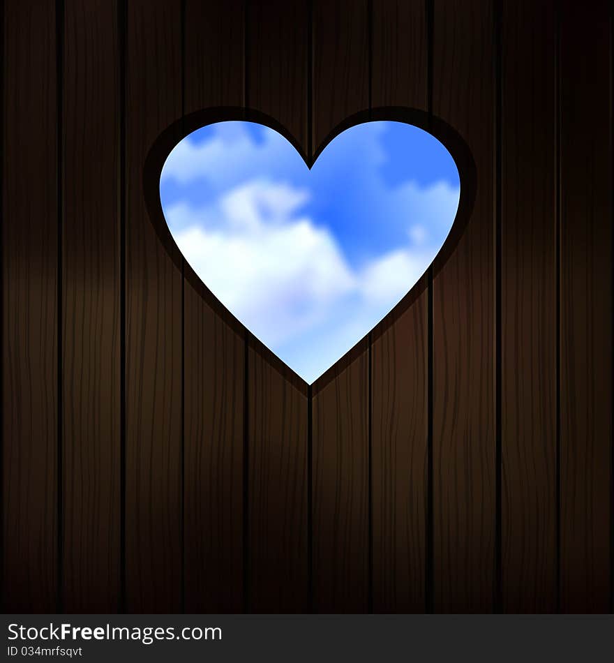 Heart shape cut into wooden door. Heart shape cut into wooden door