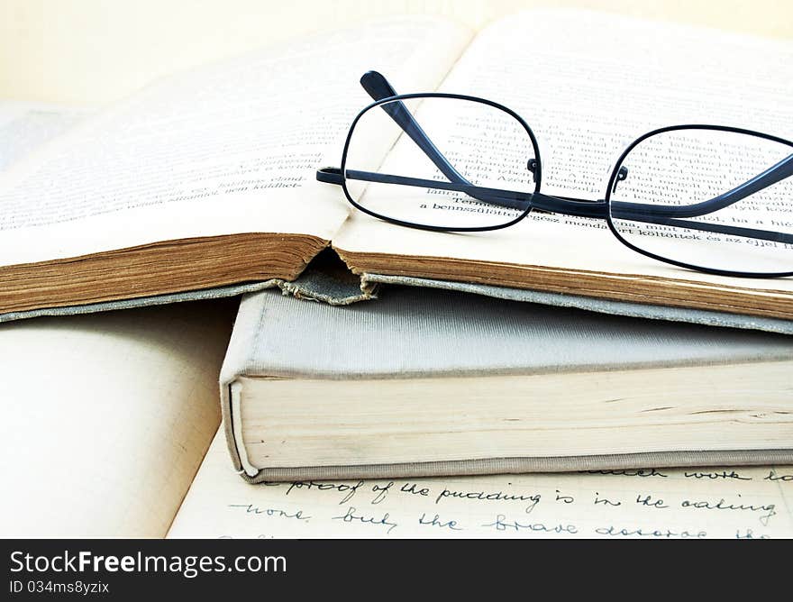 Vintage books and glasses still life