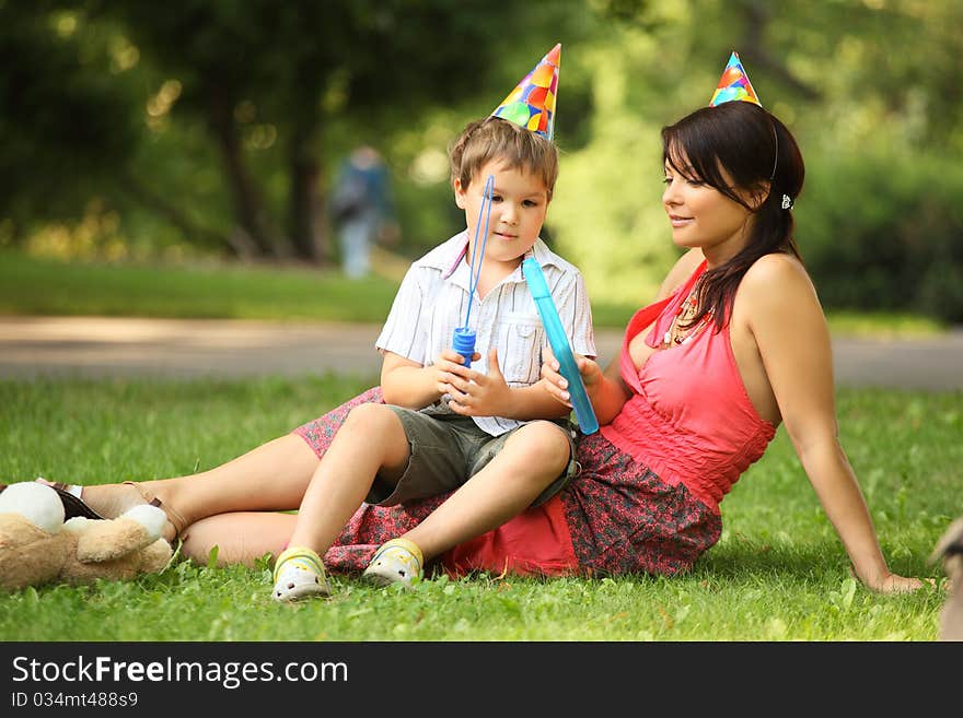 Mother and son in park on birthday. Mother and son in park on birthday