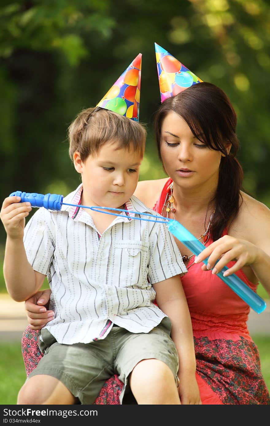 Young mother with son outdoors. Young mother with son outdoors