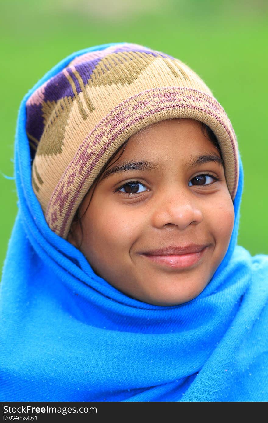 Cute girl face isolated over green background.