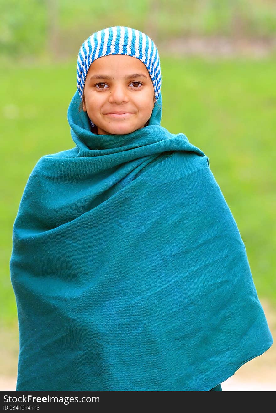 Cute muslim girl with green background.