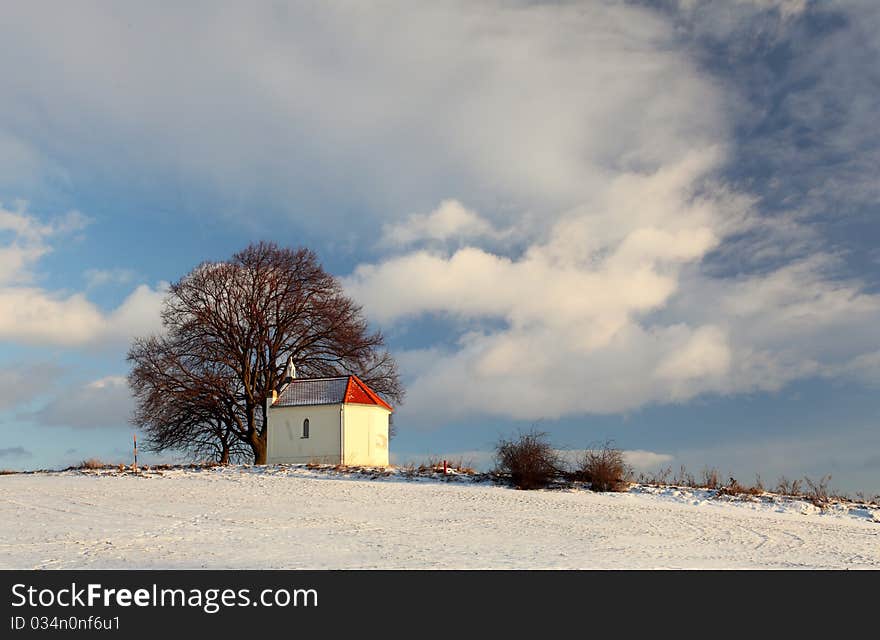 Frozen field with a chapel