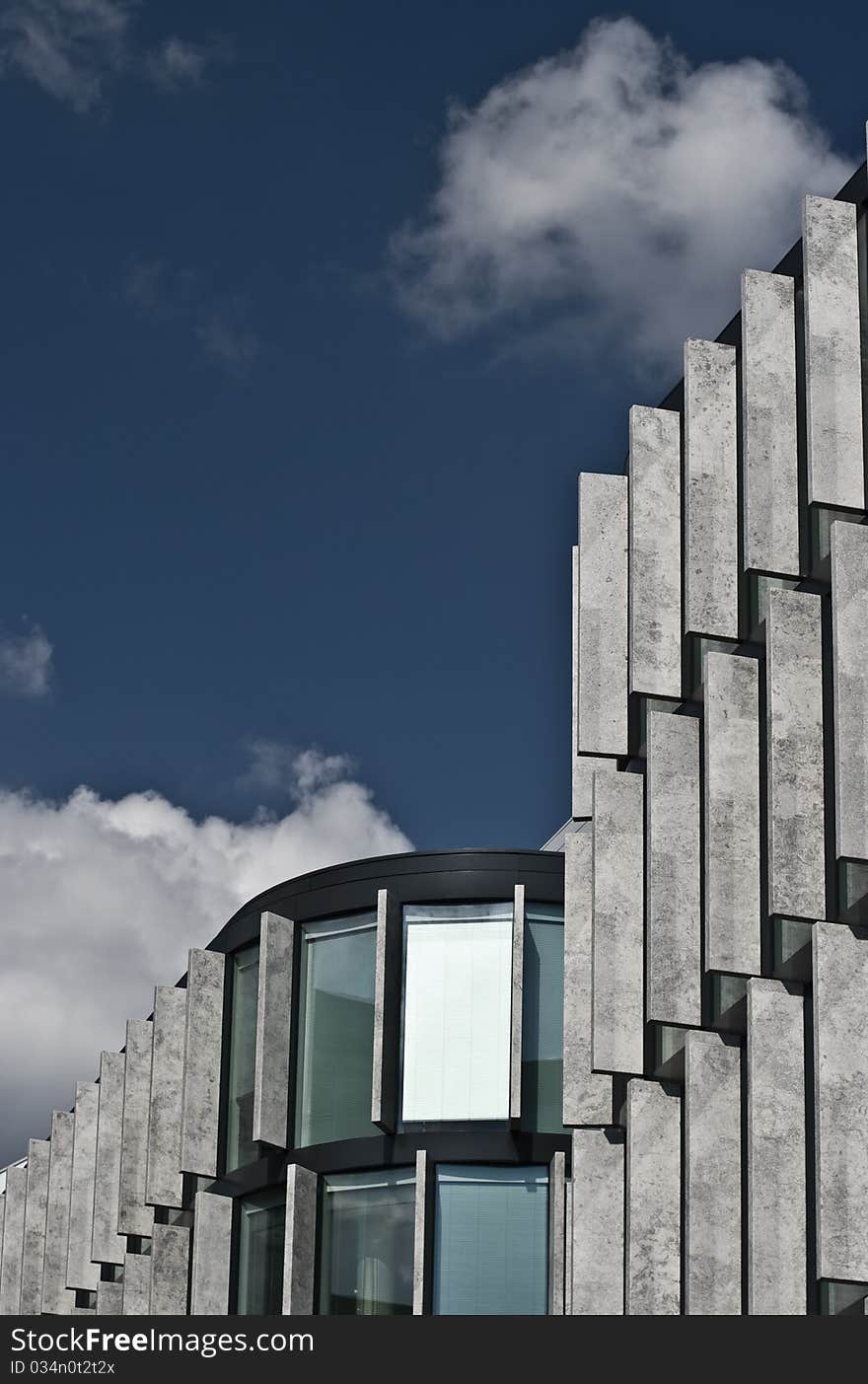 Facade of a modern building - stone and glass