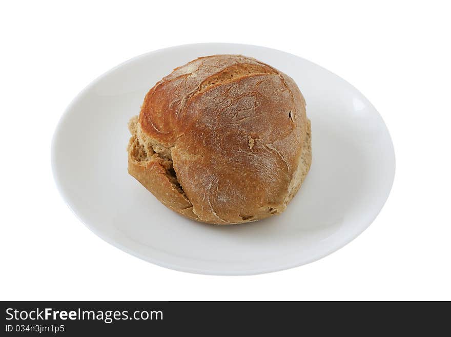 One bread on an small white plate. One bread on an small white plate