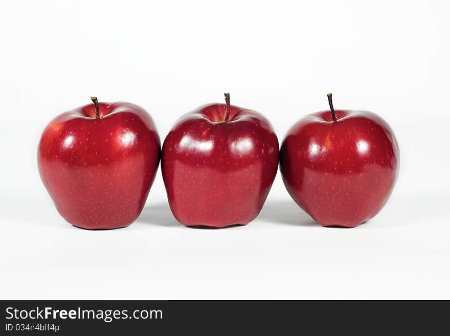 Three red apples