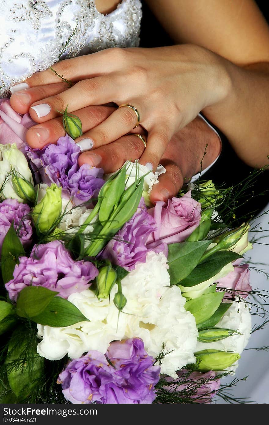 Wedding Rings Over Bouquet