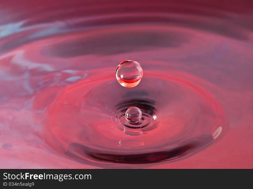 Coloured water drop on reservoir. Coloured water drop on reservoir