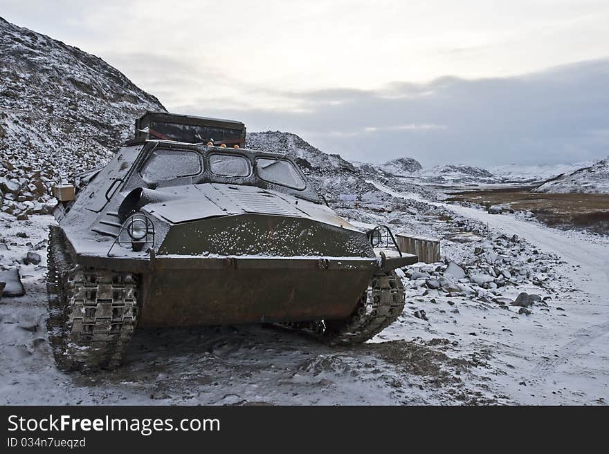 All-terrain vehicle standing in mountainous area close to Barents Sea in Kola Peninsula (Russia). All-terrain vehicle standing in mountainous area close to Barents Sea in Kola Peninsula (Russia)