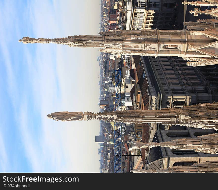 View of Duomo square and Milan roofs from the rooftop of Duomo Cathedral. View of Duomo square and Milan roofs from the rooftop of Duomo Cathedral.