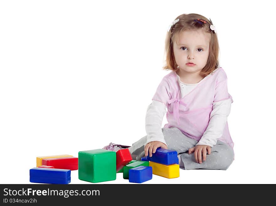 Little girl playing with cubes