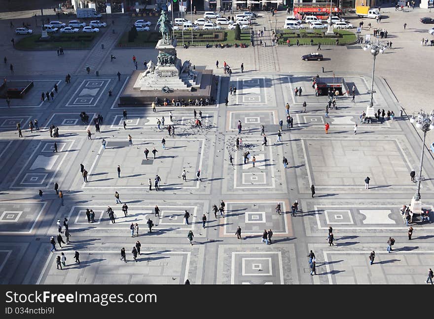 Panoramic view of people walking in Duomo square, aerail view from Duomo cathedral rooftop. Panoramic view of people walking in Duomo square, aerail view from Duomo cathedral rooftop.