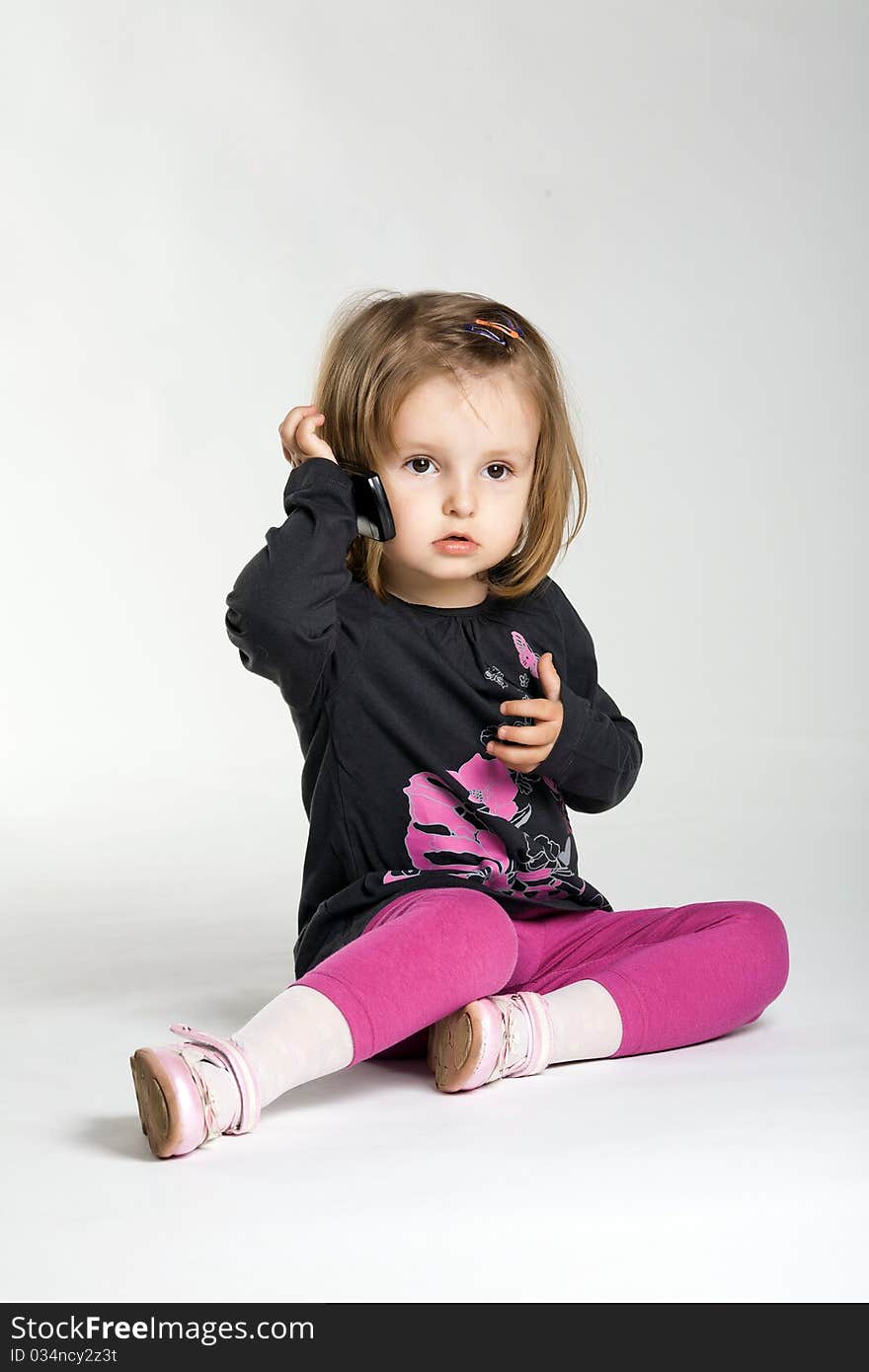 Little girl with mobile phone