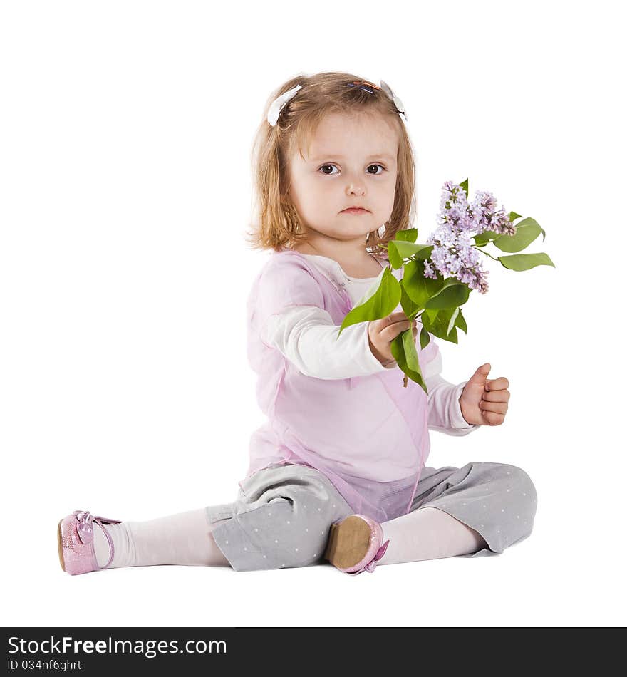 Little girl giving a branch of lilac isolated