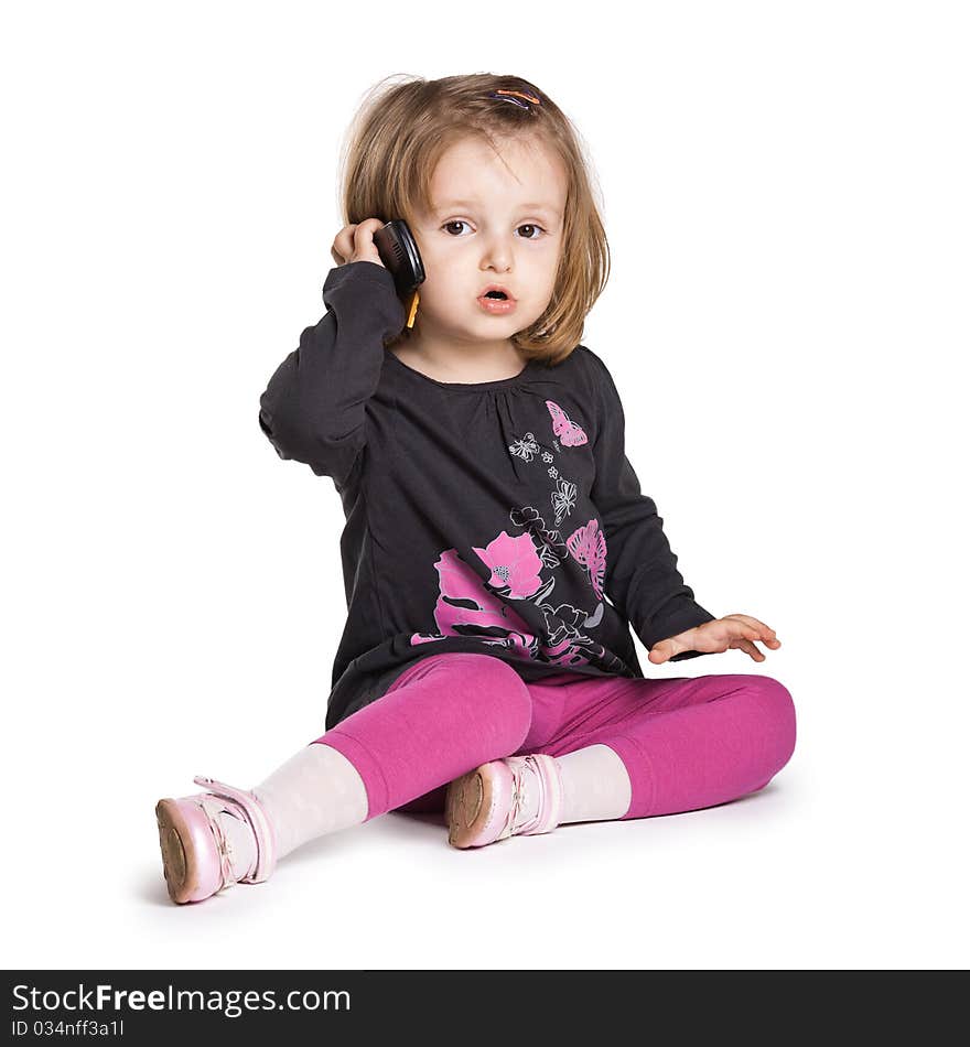 Little girl with mobile phone isolated